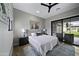 Bedroom with queen bed, sliding door to backyard and desert art at 25582 N 89Th St, Scottsdale, AZ 85255