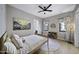 Light and airy bedroom featuring a large window and ceiling fan at 25582 N 89Th St, Scottsdale, AZ 85255