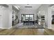 Bright dining room with a large wooden table and black leather chairs at 25582 N 89Th St, Scottsdale, AZ 85255