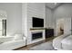 Elegant fireplace in main bedroom with built-in shelving at 25582 N 89Th St, Scottsdale, AZ 85255