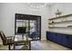 Home office with built-in shelves, desk, and backyard view at 25582 N 89Th St, Scottsdale, AZ 85255