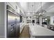 Modern kitchen features stainless steel appliances and white cabinetry at 25582 N 89Th St, Scottsdale, AZ 85255