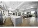 Spacious kitchen boasts a large island, white cabinets, and high-end appliances at 25582 N 89Th St, Scottsdale, AZ 85255