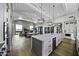 Open concept kitchen with white cabinets, a large island, and high ceilings at 25582 N 89Th St, Scottsdale, AZ 85255