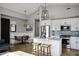 Modern kitchen with white cabinets, an island, and breakfast nook at 25582 N 89Th St, Scottsdale, AZ 85255