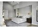 Main bedroom with large bed, hardwood floors, and ensuite bathroom at 25582 N 89Th St, Scottsdale, AZ 85255