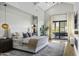 Spacious main bedroom with plush bedding and access to a private patio at 25582 N 89Th St, Scottsdale, AZ 85255
