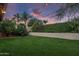 Landscaped backyard with grassy area and string lights at 26803 N 45Th Pl, Cave Creek, AZ 85331