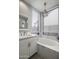 Bathroom featuring a soaking tub, a vanity with white cabinets, and window with blinds at 26803 N 45Th Pl, Cave Creek, AZ 85331