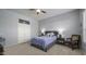 Cozy bedroom with a double bed, nightstand, and comfortable armchair at 26803 N 45Th Pl, Cave Creek, AZ 85331