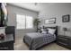 Spacious bedroom with window, dresser, and a comfortable bed at 26803 N 45Th Pl, Cave Creek, AZ 85331