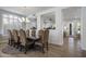 Open concept dining room with hardwood floors and seating for six at 26803 N 45Th Pl, Cave Creek, AZ 85331
