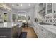 Modern kitchen with white cabinets, a large island, and stainless steel appliances at 26803 N 45Th Pl, Cave Creek, AZ 85331