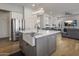 Kitchen with a large island, white cabinets, and a farmhouse sink at 26803 N 45Th Pl, Cave Creek, AZ 85331