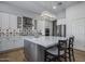Modern kitchen with white cabinets, a large island, and stainless steel appliances at 26803 N 45Th Pl, Cave Creek, AZ 85331