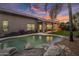Stunning pool and spa with a rock waterfall feature at 26803 N 45Th Pl, Cave Creek, AZ 85331