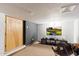Finished basement with large screen TV, comfortable seating, and ample storage at 31048 N 56Th St, Cave Creek, AZ 85331