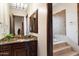 Bathroom with granite vanity and step-up soaking tub at 31048 N 56Th St, Cave Creek, AZ 85331