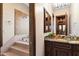 Elegant bathroom with granite vanity and soaking tub at 31048 N 56Th St, Cave Creek, AZ 85331
