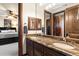 Double vanity bathroom with granite countertops and a large mirror at 31048 N 56Th St, Cave Creek, AZ 85331