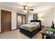 Spacious bedroom with a king-size bed, balcony access, and built-in drawers at 31048 N 56Th St, Cave Creek, AZ 85331