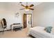 Bright bedroom with a ceiling fan and ensuite bath access at 31048 N 56Th N St, Cave Creek, AZ 85331