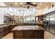 Spacious kitchen featuring granite countertops, island, and high-end appliances at 31048 N 56Th St, Cave Creek, AZ 85331