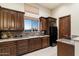 Well-equipped kitchen with granite counters and wood cabinets at 31048 N 56Th St, Cave Creek, AZ 85331