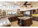 Gourmet kitchen with granite island, stainless steel appliances, and custom cabinetry at 31048 N 56Th St, Cave Creek, AZ 85331