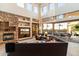 Spacious living room with a stone fireplace and backyard access at 31048 N 56Th St, Cave Creek, AZ 85331