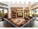 Living area with stone fireplace and views to the backyard at 31048 N 56Th St, Cave Creek, AZ 85331