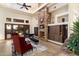 Living room features a stone fireplace and built-in wooden shelving at 31048 N 56Th St, Cave Creek, AZ 85331