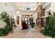 Spacious living room with stone fireplace, high ceilings, and hardwood floors at 31048 N 56Th St, Cave Creek, AZ 85331