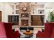 Elegant living room with a cozy fireplace and comfortable seating at 31048 N 56Th St, Cave Creek, AZ 85331