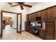 Home office with wood cabinets, granite desk, and printer at 31048 N 56Th St, Cave Creek, AZ 85331