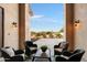 Relaxing patio area with wicker seating and a glass-top coffee table at 31048 N 56Th St, Cave Creek, AZ 85331