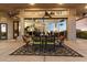 Covered patio with dining area and large windows overlooking the interior at 31048 N 56Th St, Cave Creek, AZ 85331