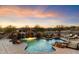 Expansive pool with a waterfall and plenty of space for relaxation at 31048 N 56Th St, Cave Creek, AZ 85331
