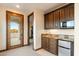 Wet bar with granite countertop, microwave, and mini-refrigerator at 31048 N 56Th St, Cave Creek, AZ 85331