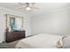 Bedroom with a dresser, TV, and large mirror at 3437 W Angela Dr, Phoenix, AZ 85053