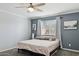 Main bedroom with a king-size bed and ensuite bathroom at 3437 W Angela Dr, Phoenix, AZ 85053