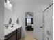 Bathroom with single vanity, and view into bedroom at 35208 W Santa Monica Ave, Maricopa, AZ 85138