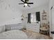 Charming Bedroom with crib, dresser, and whimsical wall decor at 35208 W Santa Monica Ave, Maricopa, AZ 85138