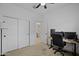 Versatile bedroom with built-in desk and access to a bathroom at 35208 W Santa Monica Ave, Maricopa, AZ 85138