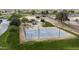 Community park featuring a basketball court, playground, and shaded seating areas at 35208 W Santa Monica Ave, Maricopa, AZ 85138