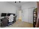 Home office with desk, chair, and built-in shelving at 35208 W Santa Monica Ave, Maricopa, AZ 85138