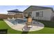 Inviting backyard pool with ample lounge space for relaxation at 35208 W Santa Monica Ave, Maricopa, AZ 85138