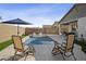 Relaxing backyard oasis with a refreshing pool and lounge chairs at 35208 W Santa Monica Ave, Maricopa, AZ 85138