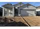 Charming single-story home featuring a two-car garage and a well-manicured lawn at 4178 E Kolin Ln, San Tan Valley, AZ 85143