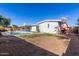 Home's backyard with a swimming pool and patio at 4227 W Hatcher Rd, Phoenix, AZ 85051